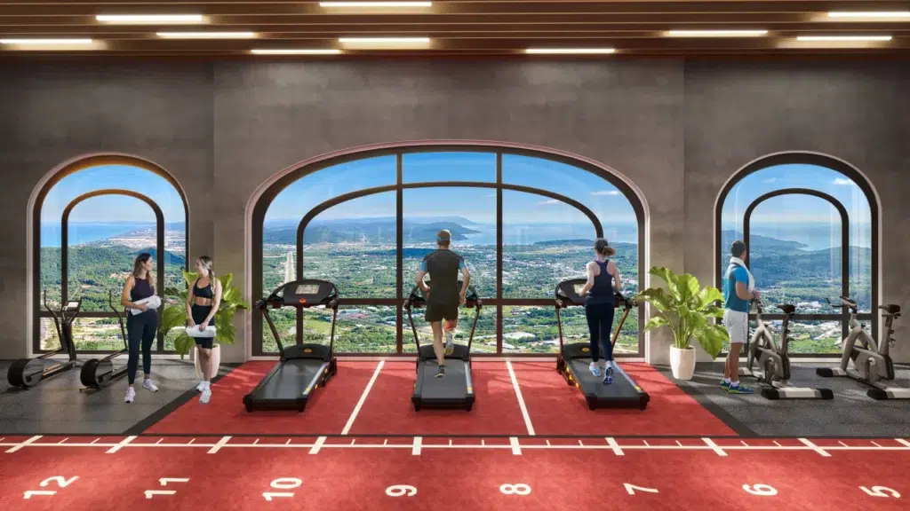 Phối cảnh phòng gym The Hill với máy chạy bộ trước các ô cửa vòm và lối vận động ở giữa